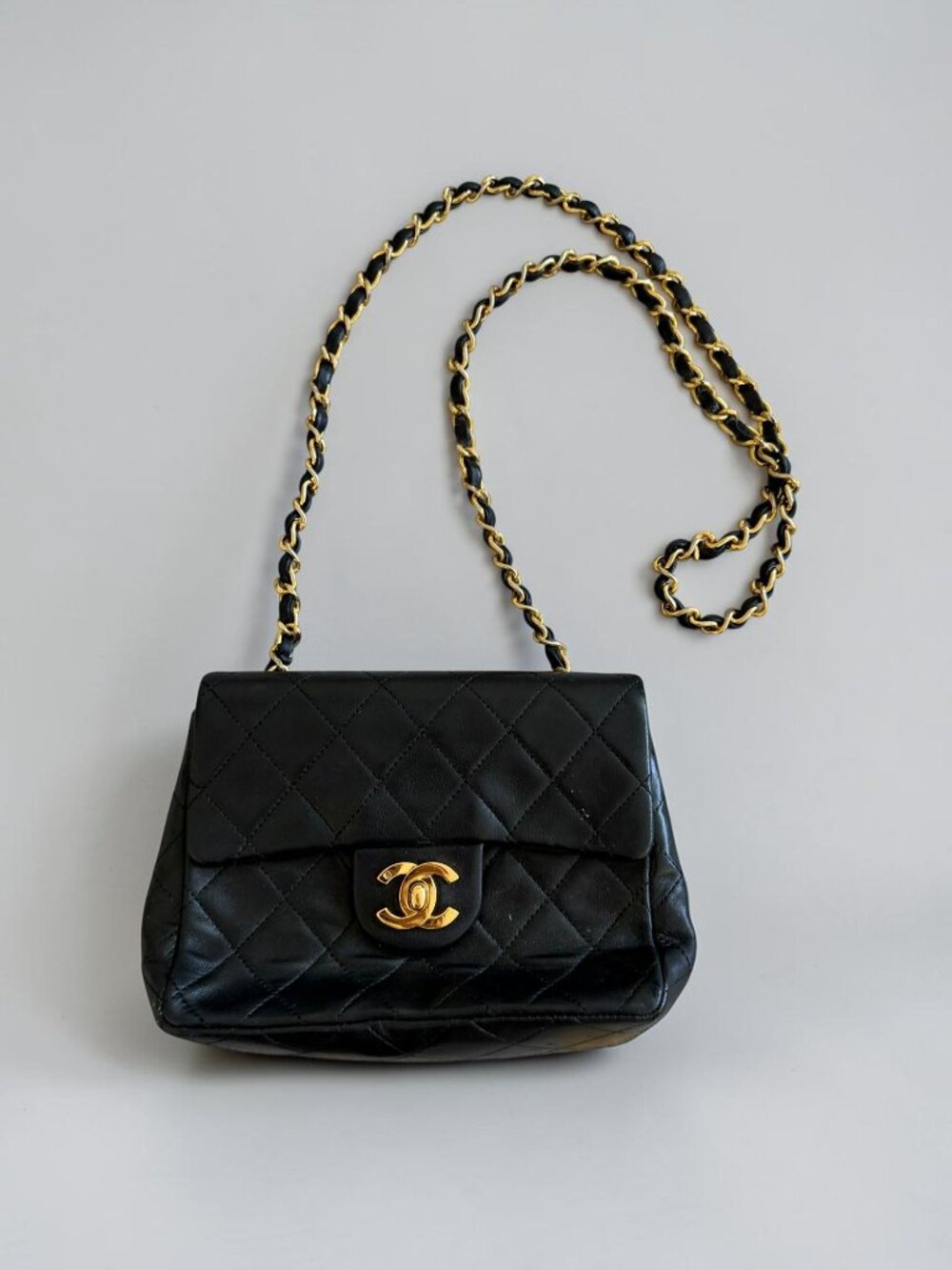 CHANEL Vintage Black Lambskin 24K Mini Flap Crossbody Bag